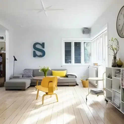 Furniture in a cluttered room before AI background cleanup